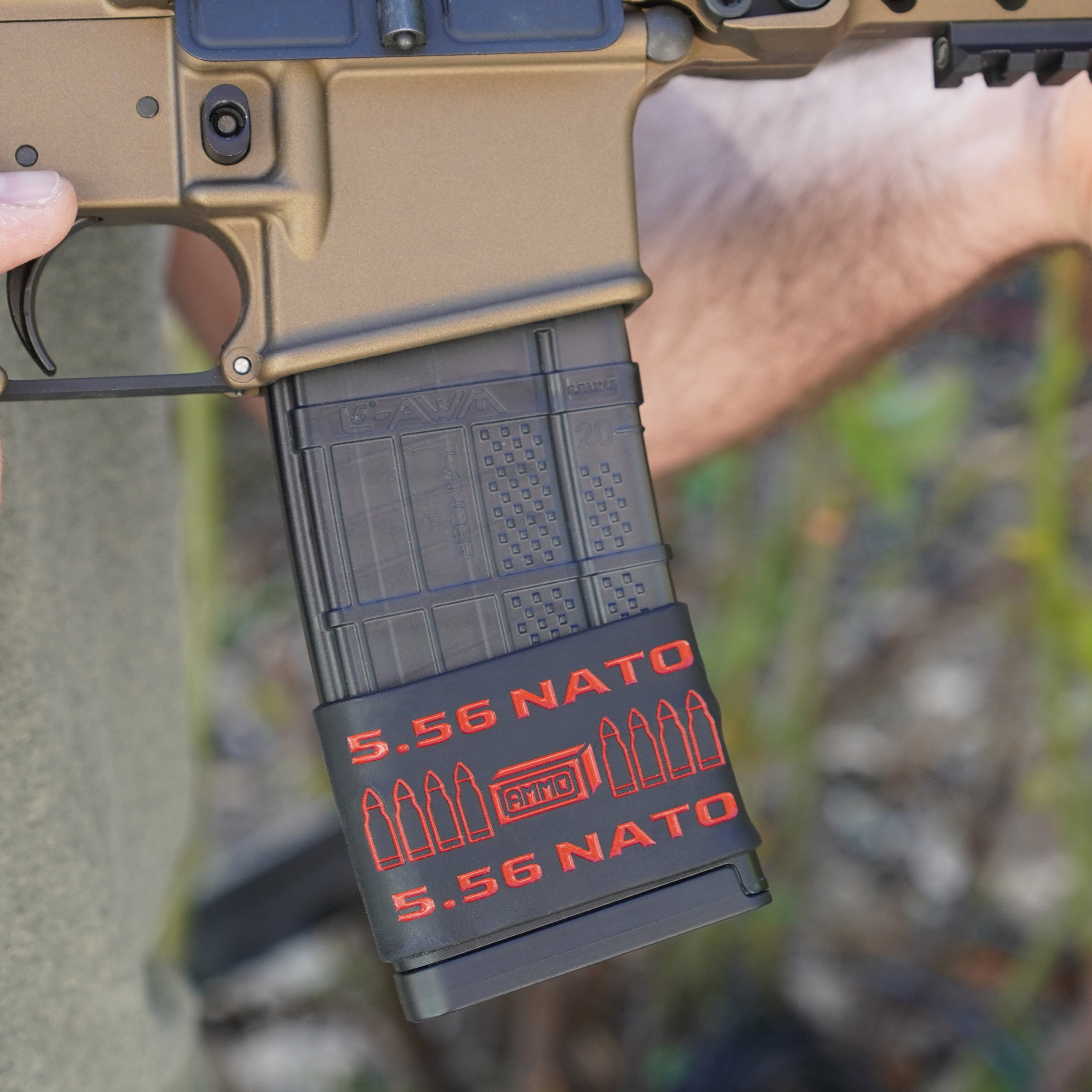 Mag-Mark Pro 5.56 NATO AMMO design magazine grip band — front view showing bullet cartridge design