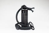 Paracord lanyard clipped to a black Storm-Strike EDC Canister